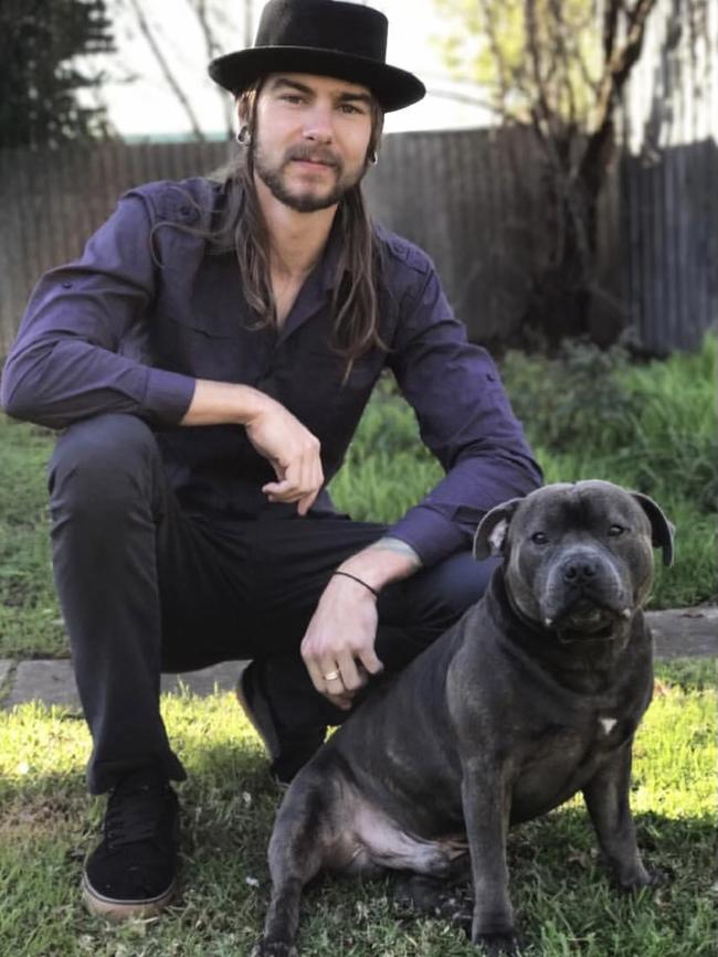 Koen Attard of Hackham West with Kato the blue staffordshire bull terrier Picture: Supplied.