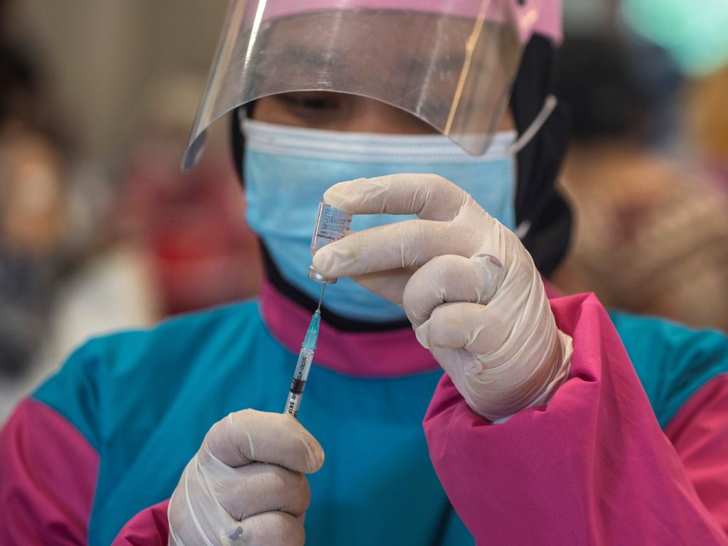 A health worker prepares to administer a vaccine for COVID-19 in Surabaya on the Indonesian island of Java on January 31. Picture: Juni Kriswanto / AFP)