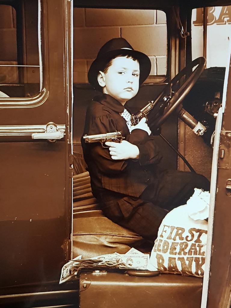 23/07/2019 - Ethan Baker posing as a gangster at Old Time Photos Surfers Paradise Picture: Old Time Photos