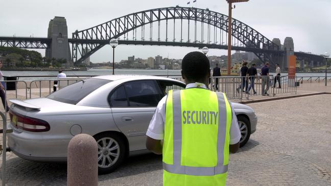 a private security officer at the Sydney Opera House forecourt.