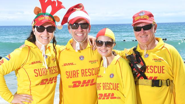 Toni Bache, Michael Bache, Aliyah Scott, Paul Revitt Gold Coasters having fun on the beach for Christmas day. Sunday December 25, 2022. Picture: John Gass