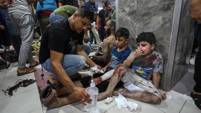 Injured Palestinians receive treatment at al-Shifa hospital in Gaza City following Israeli strikes. Picture: AFP