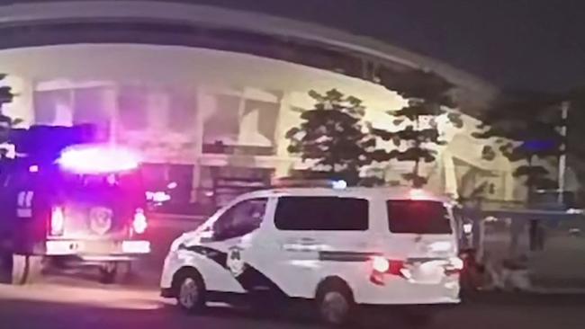 This image grab from a UGC video posted on November 11 shows emergency vehicles arriving after a driver ploughed through a crowd of people exercising at a sports center in Zhuhai. Picture: UGC/AFP