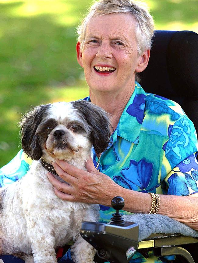 Betty Cuthbert cuddles her pet dog Zorro at home in 2003. Picture: Wayne Ludbey