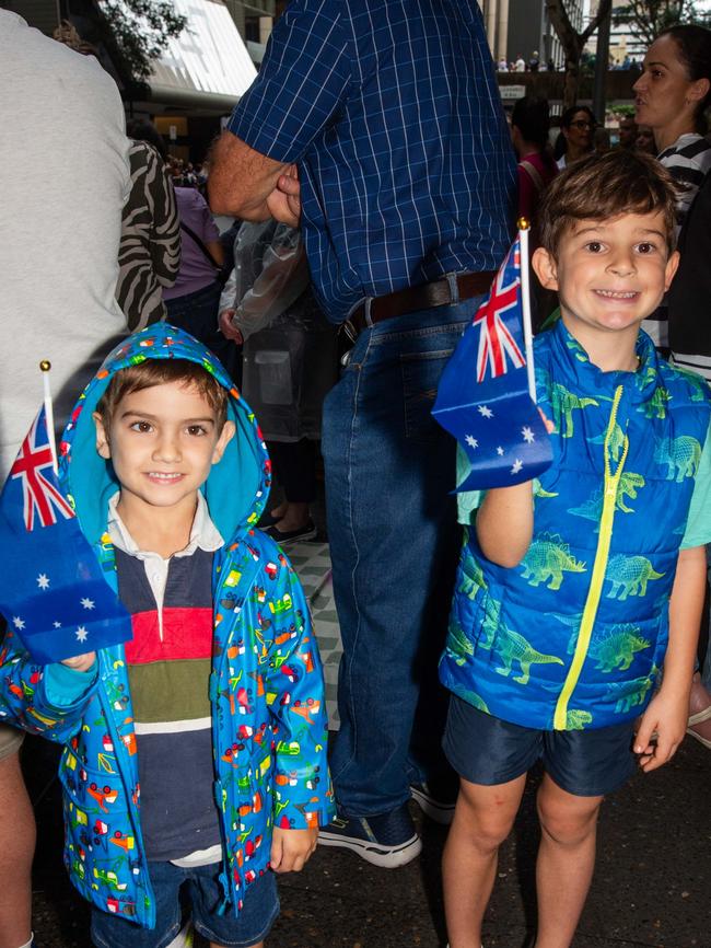 Thousands of people have braved the rain to gather in Brisbane for Anzac Day services. Picture: Grace Kessels