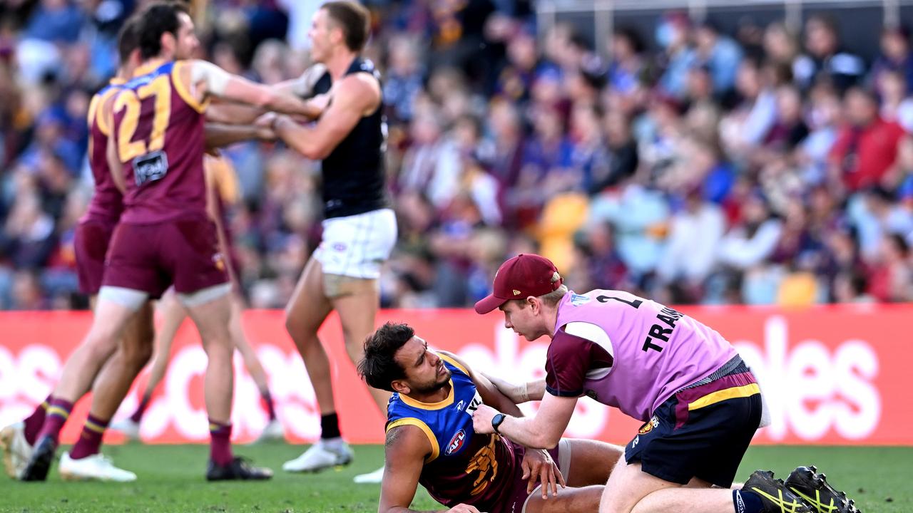 BRISBANE, AUSTRALIA - AUGUST 07: Callum Ah Chee of the Lions is injured during the round 21 AFL match between the Brisbane Lions and the Carlton Blues at The Gabba on August 07, 2022 in Brisbane, Australia. (Photo by Bradley Kanaris/Getty Images)