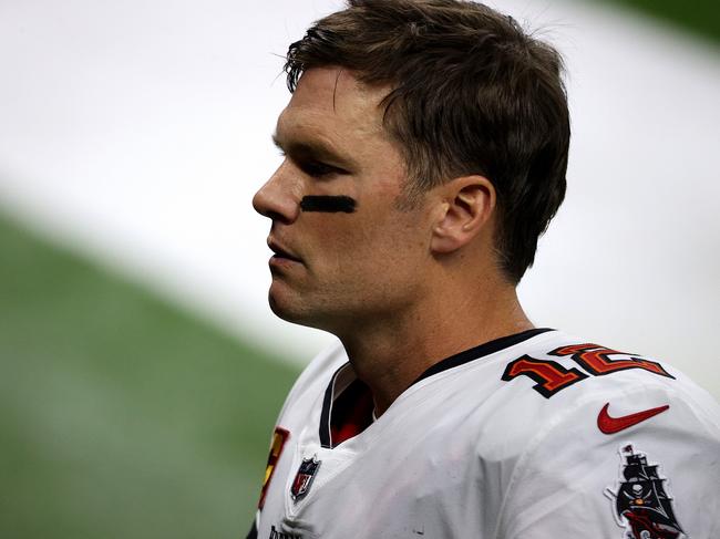 NEW ORLEANS, LOUISIANA - JANUARY 17: Tom Brady #12 of the Tampa Bay Buccaneers looks on at the end of the first half in the NFC Divisional Playoff game against the New Orleans Saints at Mercedes Benz Superdome on January 17, 2021 in New Orleans, Louisiana. (Photo by Chris Graythen/Getty Images)