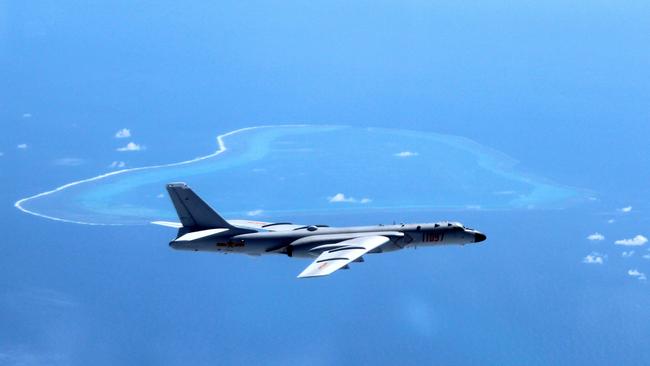 A Chinese H-6K bomber patrols the islands and reefs in the South China Sea last year — a region which is a flashpoint. Picture: Liu Rui/Xinhua/AP