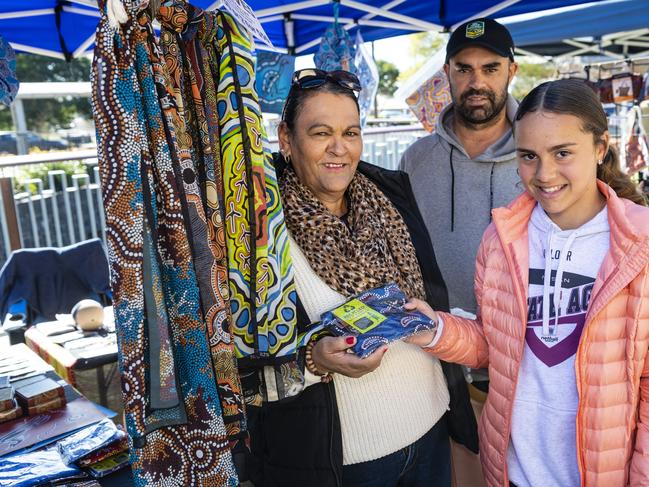 Checking out Hogarth Arts stall are (from left) Narelle, Rueben and Addyson Jackson at the NAIDOC arts and craft market at Grand Central, Saturday, July 9, 2022. Picture: Kevin Farmer