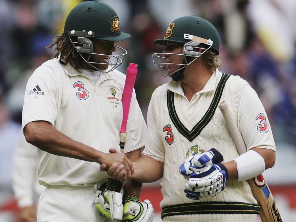 Andrew Symonds, 154 not out at the close of play, is congratulated by Shane Warne on day two of the 2006 Boxing Day Test. Picture: Hamish Blair/Getty Images