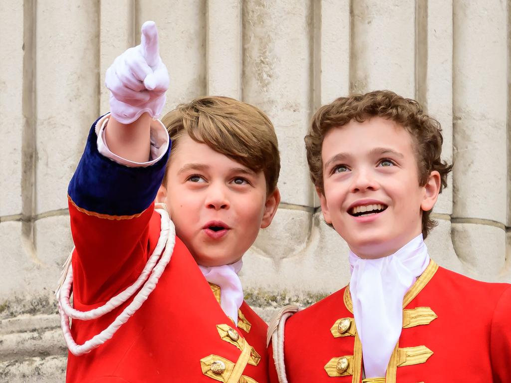 Prince George watches the jets of the Red Arrows closely. Picture: AFP