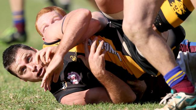 Shane Crawford is tackled. Picture: Tait Schmaal