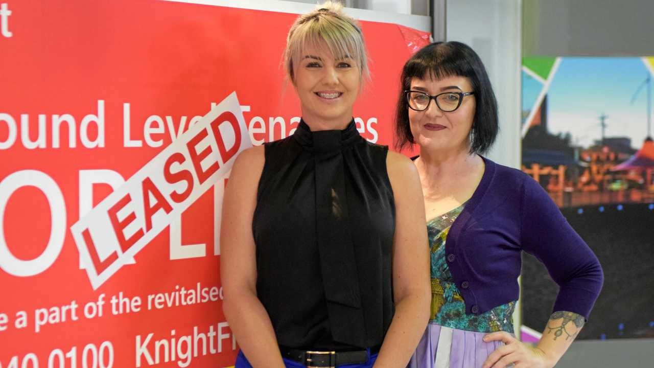 LEASED: Knight Frank representative Louise Slater celebrates a new lease with tenant Work Connection CEO Katie Bright. Picture: Ashley Pillhofer