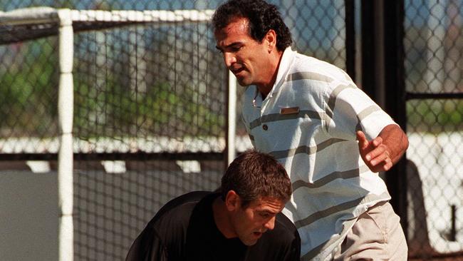 George Clooney playing basketball at the gym on June 15, 1997 with Julien Petit.