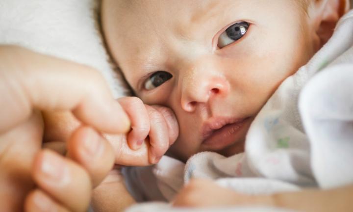 Palmar Grasp Why newborn babies have clenched fists most of the