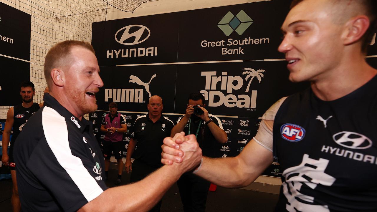 Michael Voss and Patrick Cripps embrace after the match. Picture: Michael Klein