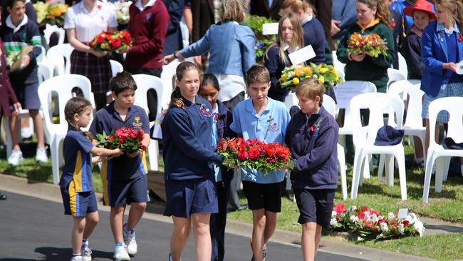 Schoolchildren lay wreaths on the steps of the Shrine for Remembrance Day. Picture: Alex Coppel.