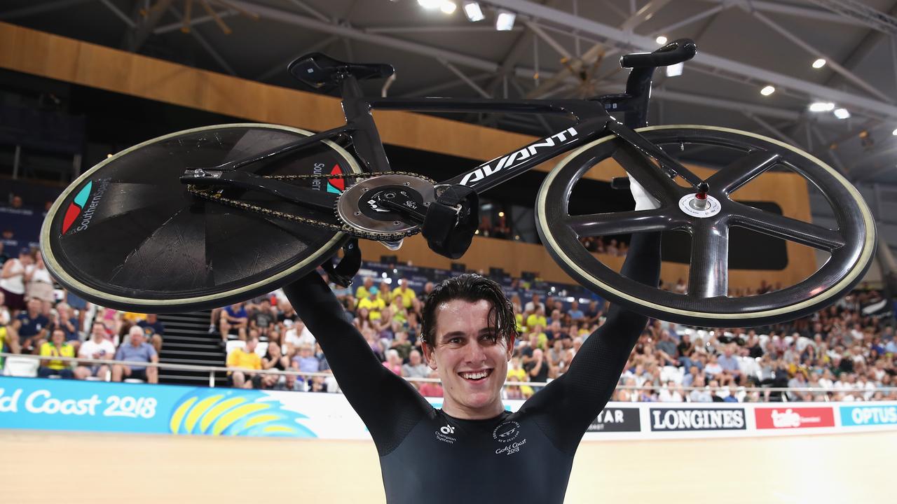 Sam Webster celebrates winning gold in the men's sprint final at the velodrome.