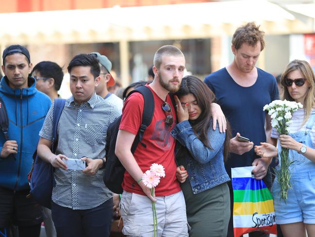 Grieving pedestrians line up to pay their respects. Picture: Alex Coppel.