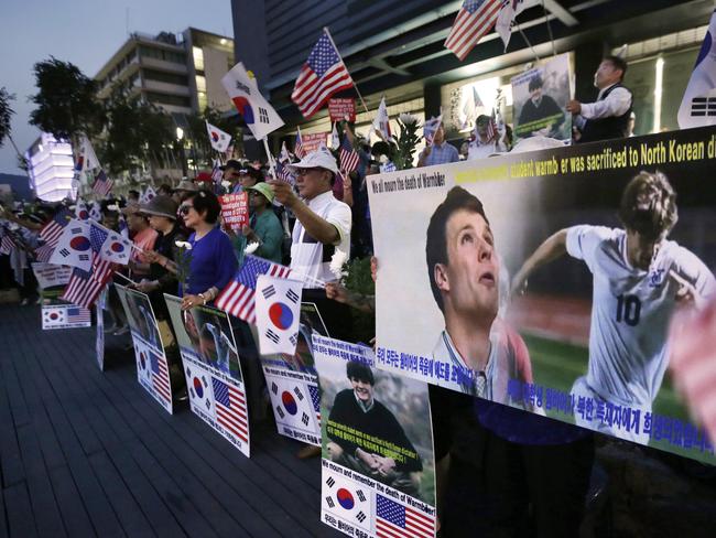 Supporters stage a memorial rally for the late American student near the US Embassy in Seoul. Picture: Ahn Young-join/AP