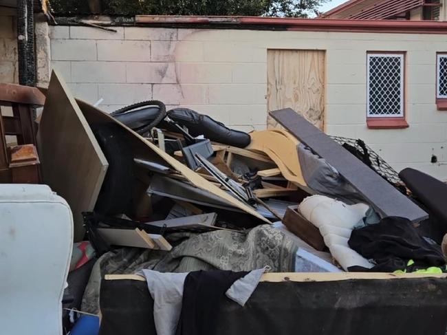 A western suburbs complex has become a dumping ground and haven for squatters with some units abandoned and left to rot during the state’s housing crisis.  Picture: 7NEWS