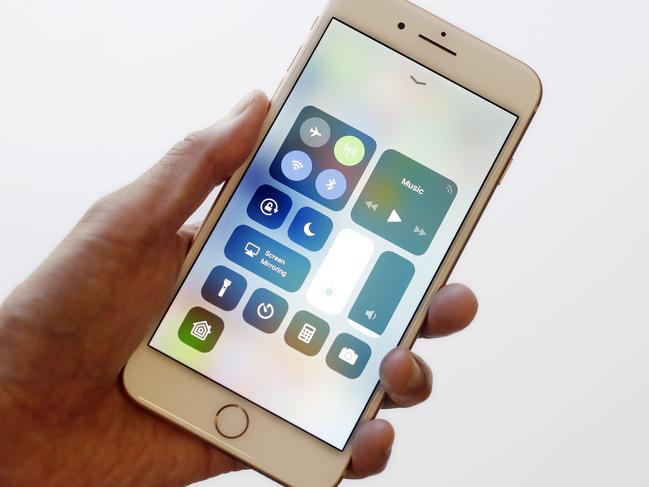 In this Sept. 15, 2017, photo, the iOS 11 control center is displayed on the iPhone 8 Plus in New York. The control center offers easy access to the flashlight and other tools with a swipe up from the bottom. It got separated into multiple pages last year to increase the options available, but the extra swipes got annoying. With iOS 11, itâ€™s back to a single page. (AP Photo/Mark Lennihan)