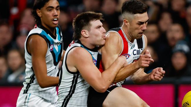 MELBOURNE, AUSTRALIA - APRIL 28: Jade Gresham of the Saints kicks a goal as he is tackled by Dylan Williams of the Power during the 2023 AFL Round 07 match between the St Kilda Saints and the Port Adelaide Power at Marvel Stadium on April 28, 2023 in Melbourne, Australia. (Photo by Dylan Burns/AFL Photos via Getty Images)