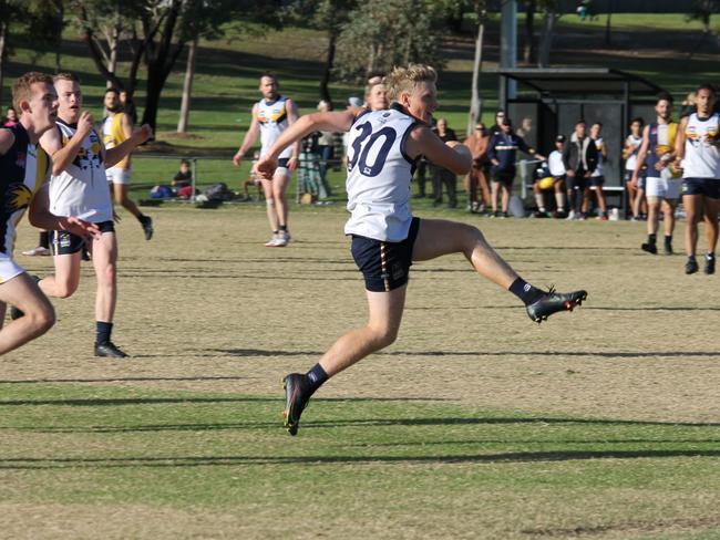 Nathan May gives it a hoof for the Saints. Pic: Narre South Saints