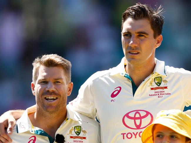 SYDNEY, AUSTRALIA - JANUARY 03: David Warner, Pat Cummins, Steve Smith and Travis Head of Australia sign the national anthem prior to the start of play on day one of the Men's Third Test Match in the series between Australia and Pakistan at Sydney Cricket Ground on January 03, 2024 in Sydney, Australia. (Photo by Darrian Traynor/Getty Images)