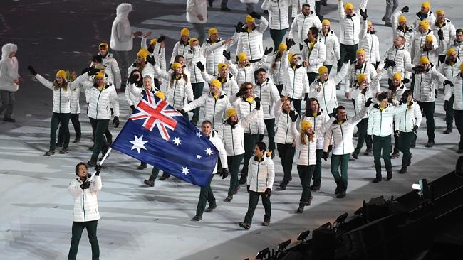Snowboarder Alex Pullin leads the Australia team into the stadium at the Winter Olympics opening ceremony.