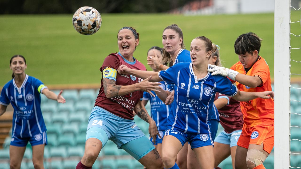 APIA skipper Charlotte Young battles for the ball in the box. Picture: Julian Andrews