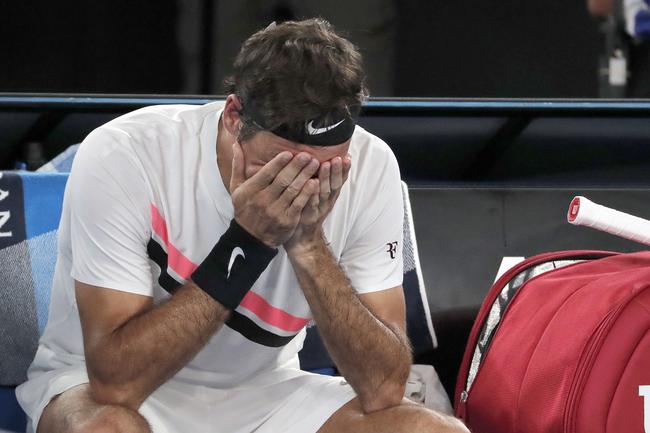 Tears flow for Roger Federer as he realises his achievement. Picture: AP