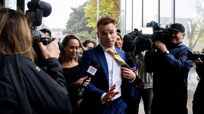 Former Seven network Spotlight producer Taylor Auerbach (centre) departs the Federal Court after giving evidence in the hearing. Picture: Bianca De Marchi.