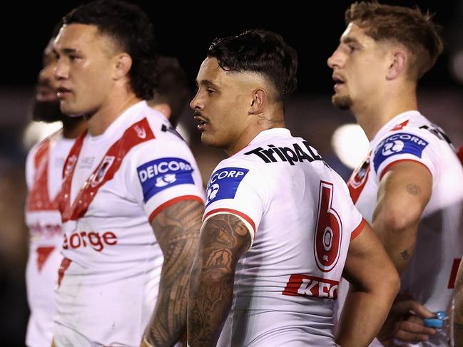 SYDNEY, AUSTRALIA - JUNE 29: Jayden Sullivan of the Dragons and team mates look dejected during the round 18 NRL match between Cronulla Sharks and St George Illawarra Dragons at PointsBet Stadium on June 29, 2023 in Sydney, Australia. (Photo by Cameron Spencer/Getty Images)