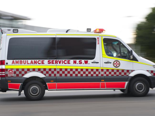 Daily Telegraph - Pictured: A generic shot of an ambulance with lights blurry fast - Currently it takes longer to catch the train from Liverpool Railway Station into the CBD of Sydney than it did in the early 1900's. All photographs taken at Liverpool Railway Station, Bigge Street, Liverpool NSW Australia