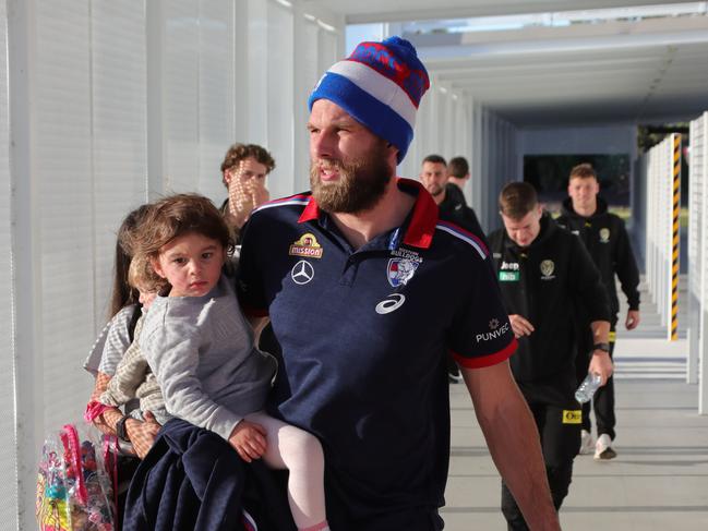 AFL players from Richmond and the Western Bulldogs arrive at the Gold Coast Airport with their families before heading to their hotels. Picture Glenn Hampson