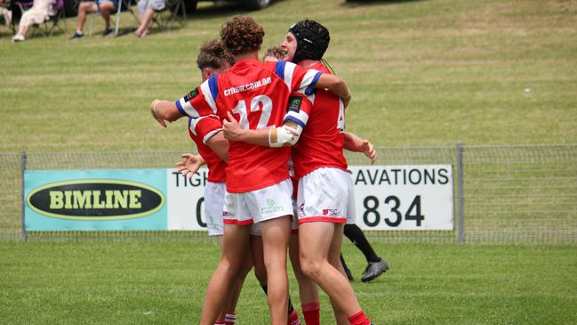 The Illawarra South Coast Dragons Andrew Johns Cup team celebrate a try. Picture: Kevin Merrigan