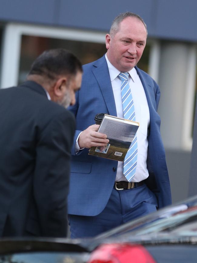 Barnaby Joyce shows off his book. Picture: John Grainger