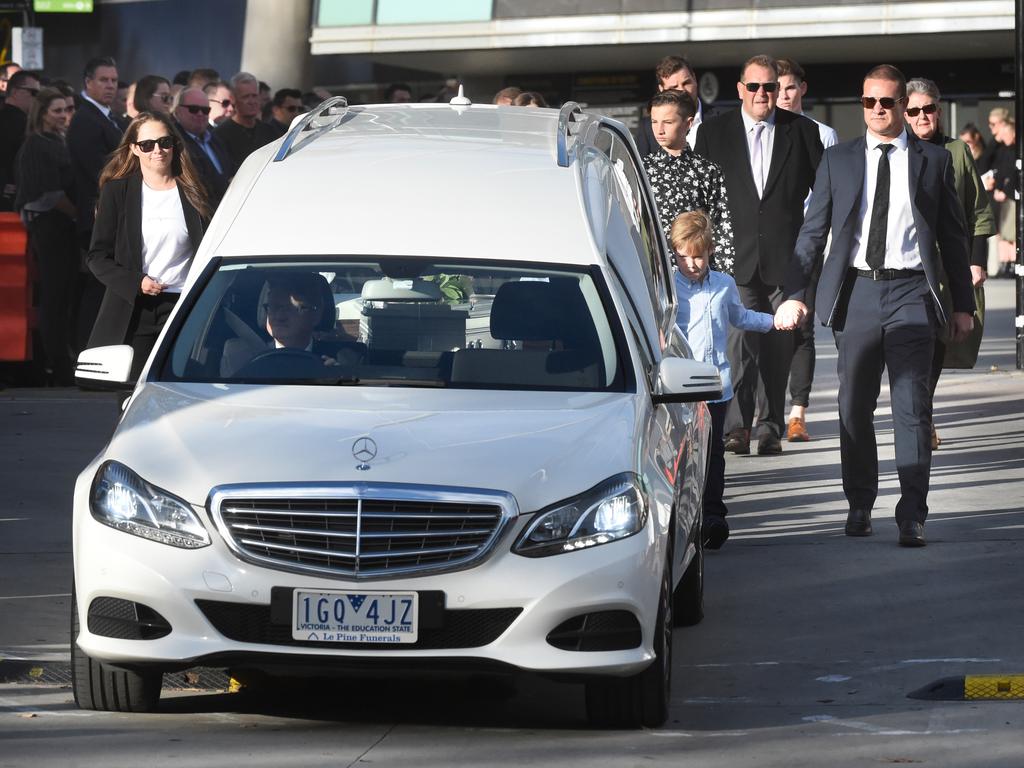 Brad Green walks behind the hearse. Picture: Tony Gough