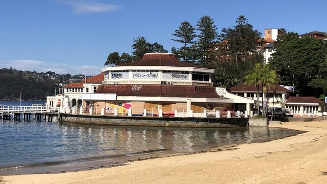 The boarded-up former Sea Life Aquarium building in Manly Cove. Picture: Jim O'Rourke