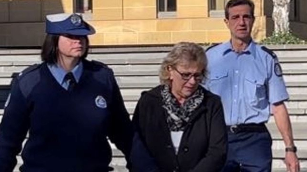 Notorious fraudster Cheryl Ann Kendall (centre) being escorted by Tasmania Police officers. Picture: Supplied/ The Vigilante News