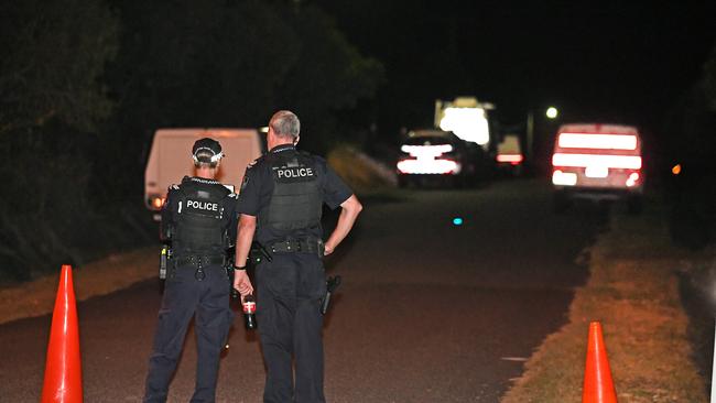 Police block the street where two bodies were found. Picture: John Gass