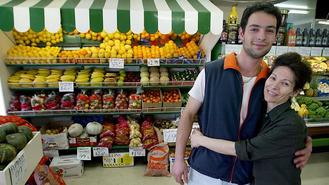 Michael Delios with his mother Voula Delios in the A and B foodstore in North Hobart back in 2003.