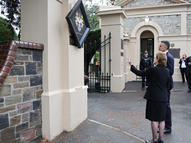 Following the death of Her Majesty Queen Elizabeth II, Her Excellency the Honourable Frances Adamson AC and the Honourable Peter Malinauskas MP are seen during the ceremony of the hanging a memorial coat of arms, known as a hatchment, on the front gates of Government House. Picture: NCA NewsWire / David Mariuz