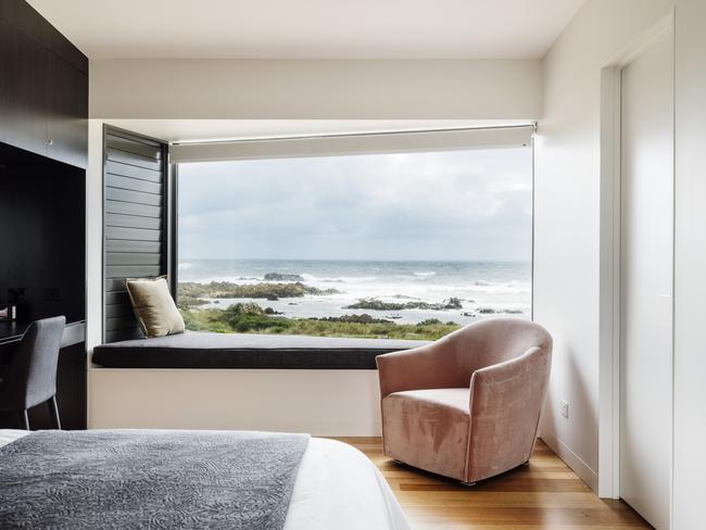 The main ocean-facing bedroom in Ettrick Rocks’ Australina retreat, complete with comfy cushioned-window seat. Picture: Adam Gibson