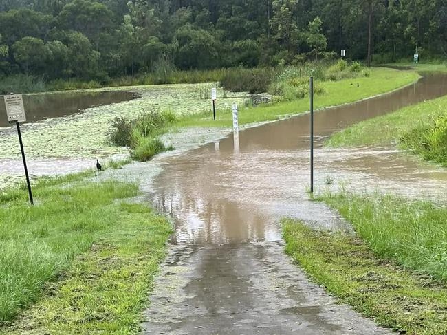 A causeway at Opossum Creek in Springfield Lakes was seen underwater on Wednesday morning. Picture: Tina Brown