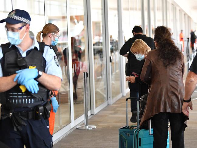 SA Police helped direct travellers at the airport. Picture: NCA NewsWire/David Mariuz