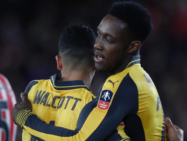 Theo Walcott celebrates scoring with Danny Welbeck.