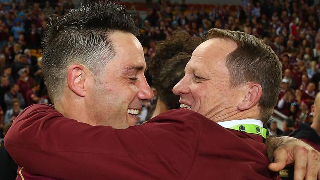 Cooper Cronk of the Maroons hugs coach Kevin Walters after winning game three of the 2017 State of Origin series.