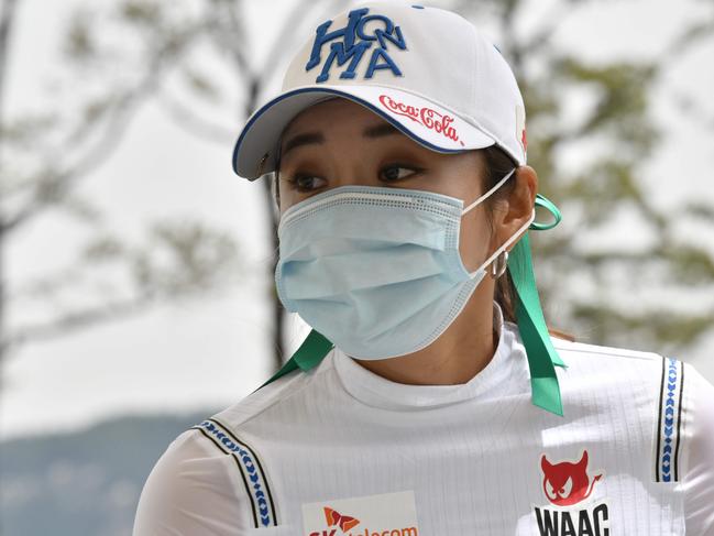 South Korean golfer Lee Bo-mee wears a face mask in the first hole during the first round of the 42nd KLPGA Championship at Lakewood Country Club in Yangju, northeast of Seoul. Picture: AFP